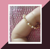 Newborn fresh water pearl and gold bracelet